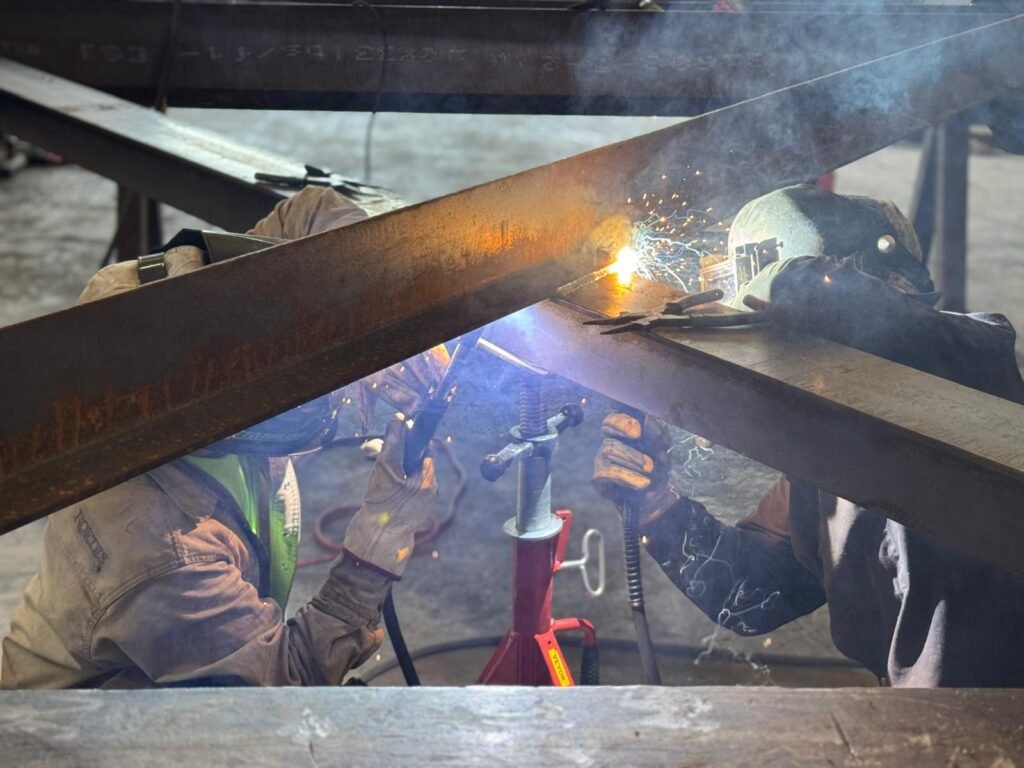 Arc Welding Fabrication team performing precision repair welding and custom metal fabrication services in Houston.
